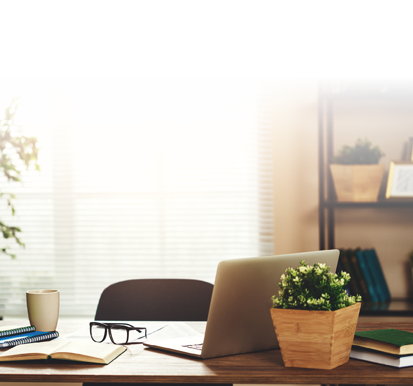workplace Desk with computer at the window in office at home in apartment