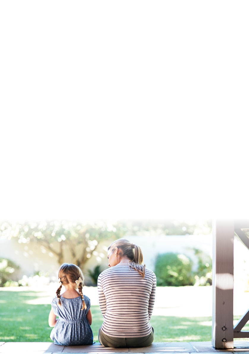 Rearview shot of a young woman and her daughter having a conversation on the porch